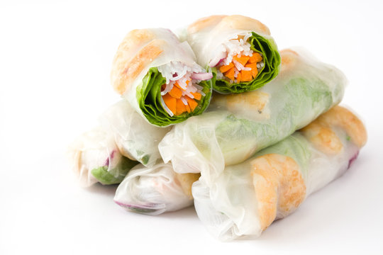 Vietnamese rolls with vegetables, rice noodles and prawns with sweet chili sauce isolated on white background
