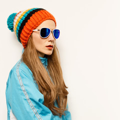 girl Pom pom hat and stylish glasses. Snowboard Warm fashion acc