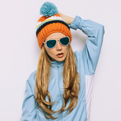Brunette Pom pom hat and stylish sunglasses. Snowboard Warm fash