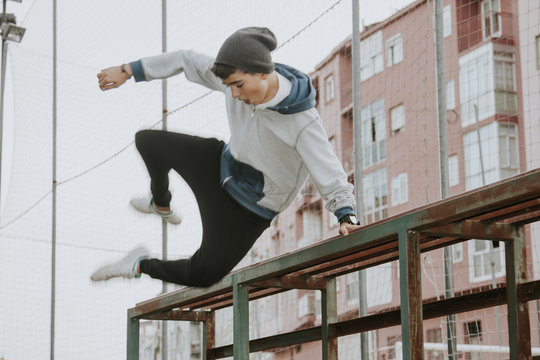 child outdoors practicing parkour