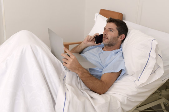 businessman intern as patient in hospital suffering disease and working happy and relaxed at clinic bed