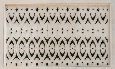 Decorative intricately carved white marble panel