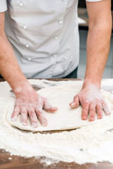 Fototapeta premium chef making pizza