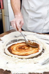 chef making pizza
