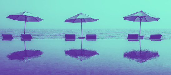 Beach umbrellas on an infinity pool