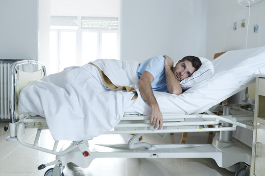 Desperate Man At Hospital Bed Alone Sad And Devastated Suffering Depression _