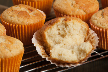 Homebaked Cupcakes In Paper Cases. Wooden Table.