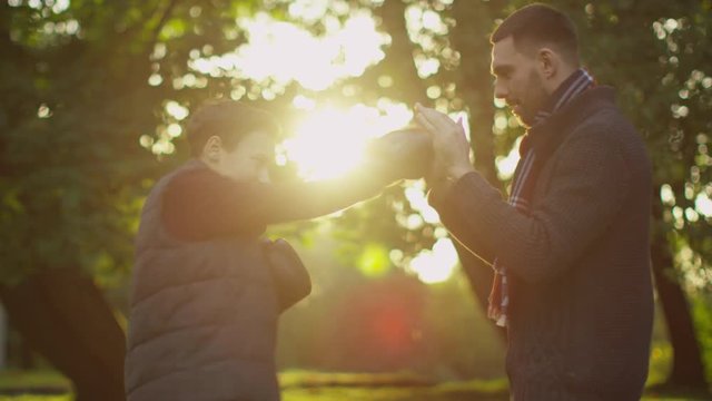 Father Teaches his Son Boxing. Fun Doing in the Park. Shot on RED Cinema Camera in 4K (UHD) 