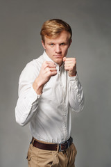 Man in white shirt doing fighting stance