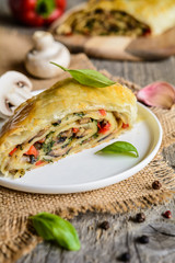 Vegetable savory strudel stuffed with mushrooms, red pepper, onion, garlic and parsley