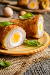 Fried pepper stuffed with pork cutlet, ham, cheese and egg