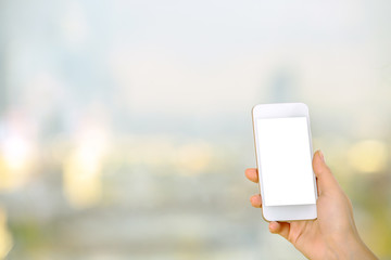 Woman holding blank white cellphone