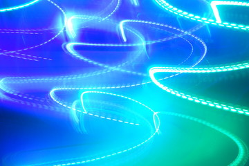 Chaotic lights in moriol blur out of focus - abstract photograph background.