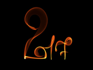 Obraz premium Happy new year 2017 isolated numbers lettering written with fire flame or smoke on black background