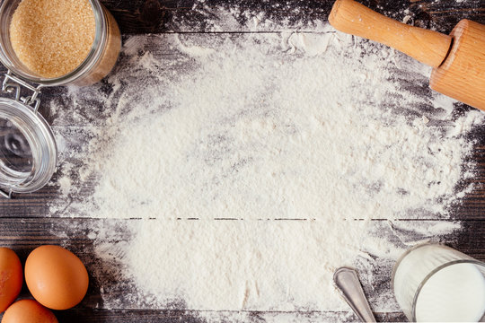 Baking background. Baking ingredients on the wooden table