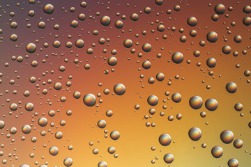 Nice orange yellow gradient color background from drops of the different size