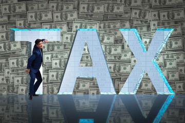 Businessman in high taxes concept