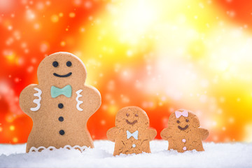 Funny gingerbread family on snow