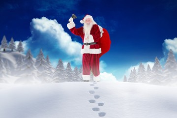 Santa claus standing in snow during christmas time