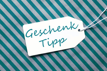 Label On Turquoise Wrapping Paper, Geschenk Tipp Means Gift Tip