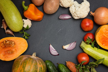 Freshvegetables on dark table. Diet  food concept.  Top view.