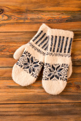 Obraz na płótnie Canvas Knitted handmade woolen mittens.