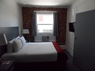 Bedroom with Brick Wall