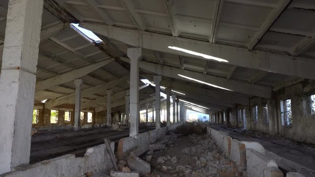 Old ruined farm animals. View of the inside. Dolly shot