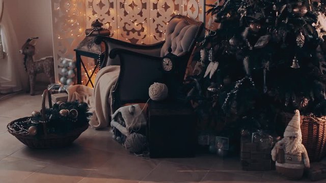 Christmas interior with armchair and a tree in shades of gray