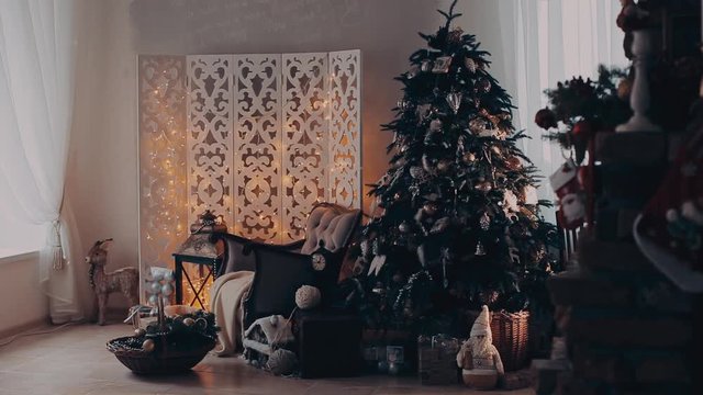 Christmas interior with armchair and a tree in shades of gray