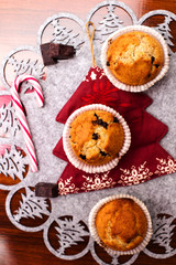 Fototapeta premium homemade muffins in christmas background