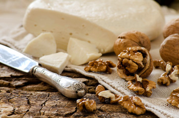 A farmer's Breakfast. Cheese and nuts. A rustic style.