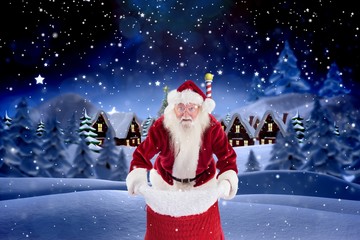 Portrait of santa claus standing with sack digitally generated b