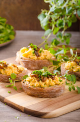 Scrambled eggs on toast with herbs