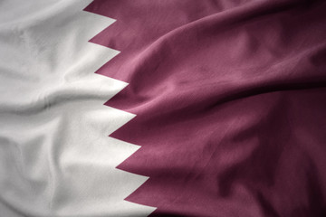 waving colorful flag of qatar.
