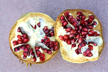 Ripe organic pomegranate, cut in half. Top view.