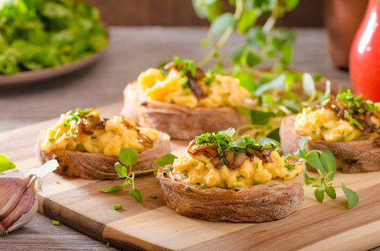 Scrambled eggs on toast with herbs
