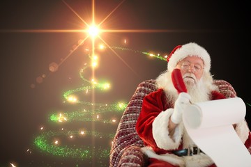 Santa claus making a list of gifts