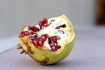 Ripe organic pomegranate, cut in half. Selective focus.
