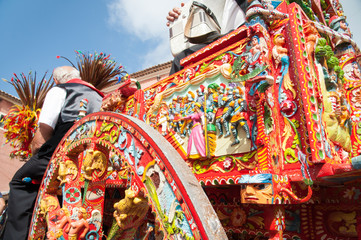 Fototapeta premium Partial view of a typical colorful Sicilian cart during a folk festival