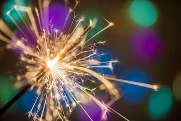 Holiday background with a sparklerr