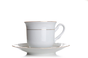 White cup and saucer isolated on white background