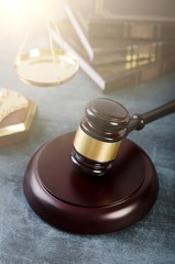 Gavel with books on grunge background