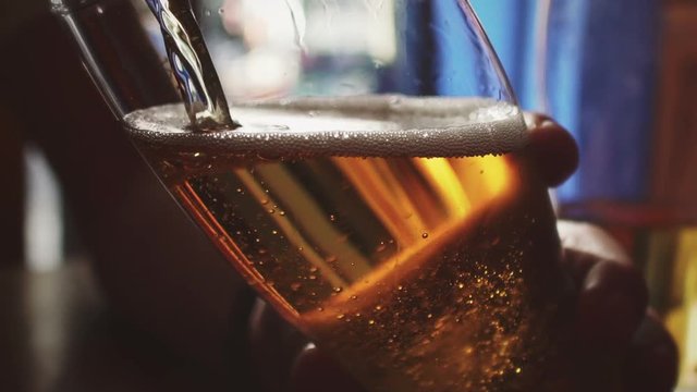 Slow motion beer pour at a restaurant