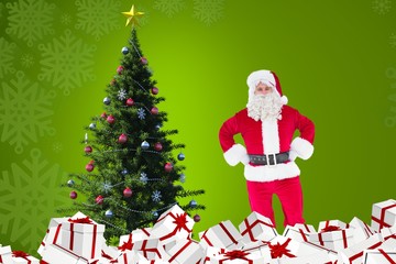 Santa claus standing near christmas tree and gifts