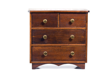 Miniature deep brown wooden chest with five drawers on white background.  Horizontal.