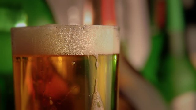 Pouring of beer into a pint glass
