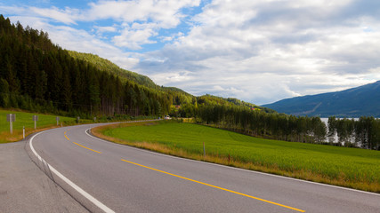 Norwegian highway car road in beautiful mountains, amazing summer landscape background, north Europe. Journey trip from Bergen to Oslo, asphalt road in beautiful nature of Norway, Scandinavia, Europe