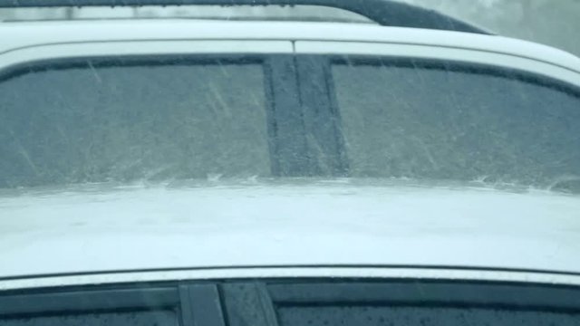 slow motion Raining over the car roof
