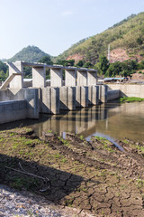 Fototapeta na wymiar Small dam in river, Dike in asia